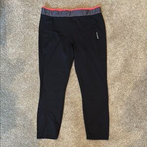 Domyos Black Athletic Leggings with Pink/orange waistband.